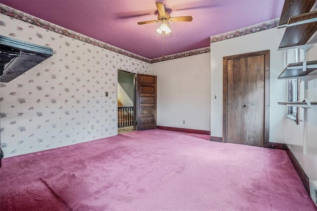 unfurnished bedroom with carpet flooring and ceiling fan