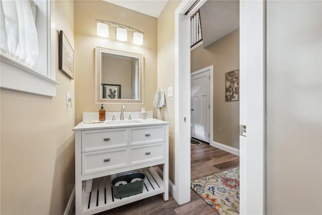 bathroom featuring vanity and wood-type flooring