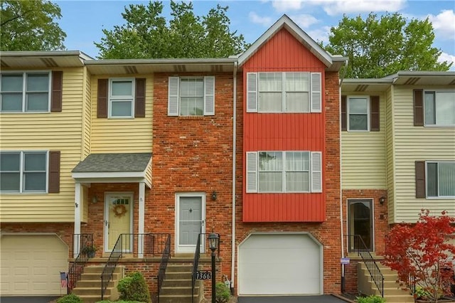 townhome / multi-family property featuring a garage