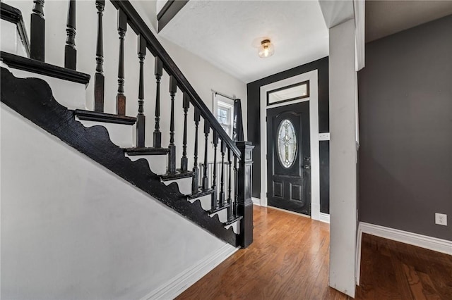 foyer entrance with hardwood / wood-style floors