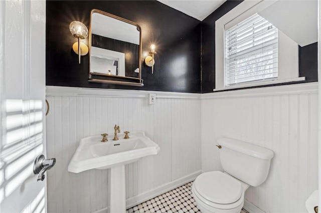 bathroom with tile patterned flooring and toilet