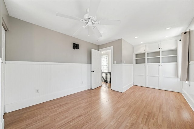 spare room featuring light hardwood / wood-style floors and ceiling fan