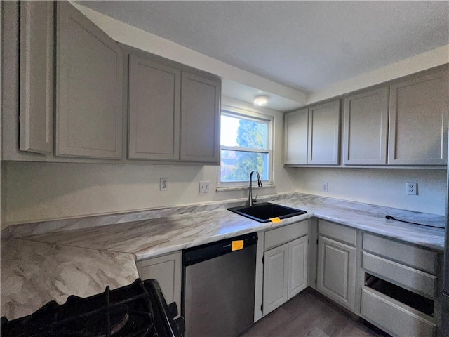 kitchen with gray cabinets, dishwasher, dark wood-type flooring, and sink