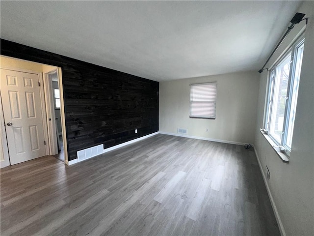 spare room featuring hardwood / wood-style flooring