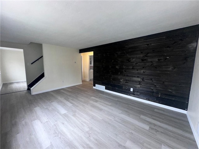 spare room featuring hardwood / wood-style flooring