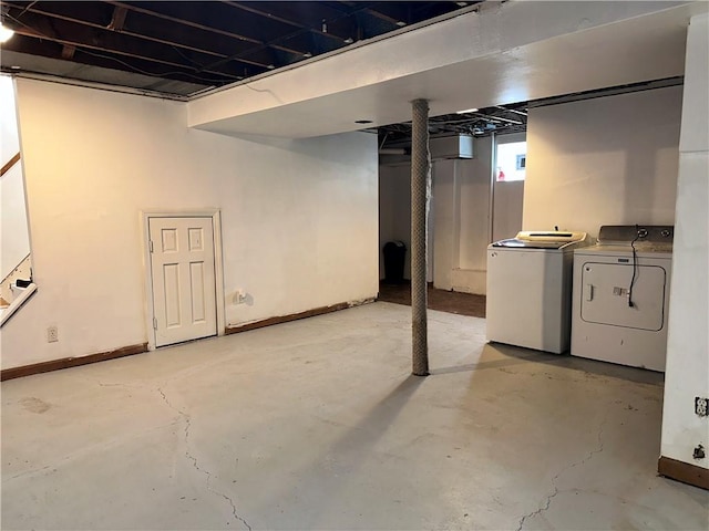 basement featuring washing machine and clothes dryer