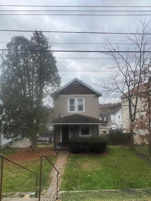 view of property featuring a front yard