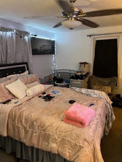 carpeted bedroom featuring ceiling fan