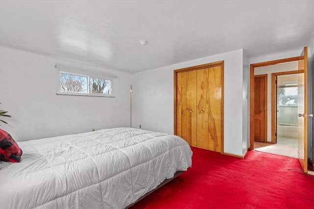 carpeted bedroom featuring a closet