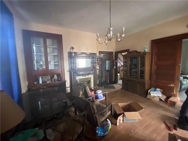 dining space featuring hardwood / wood-style floors and an inviting chandelier