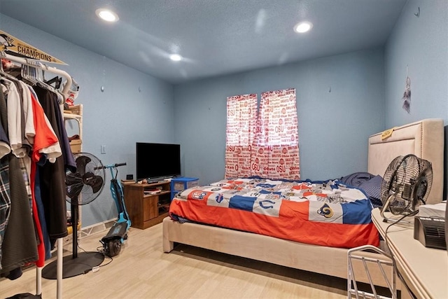 bedroom with wood-type flooring