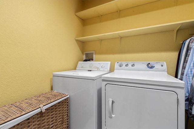 laundry area with washing machine and dryer