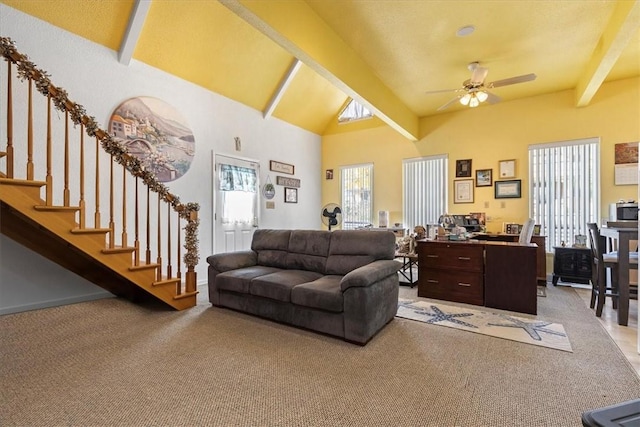 carpeted living room featuring ceiling fan, high vaulted ceiling, and beam ceiling