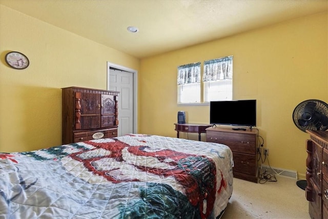 bedroom with light colored carpet