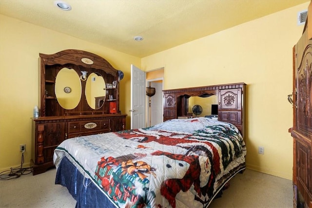 bedroom with light colored carpet