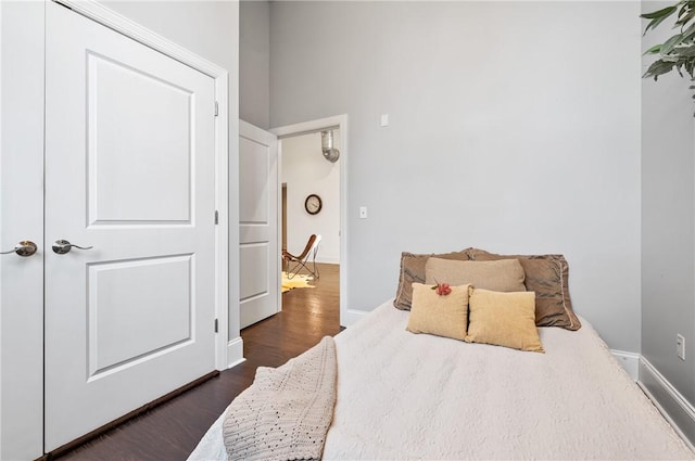 bedroom featuring a closet and dark wood-type flooring