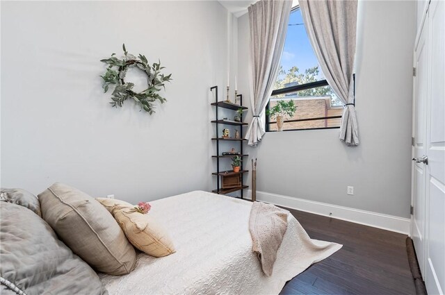 bedroom featuring dark wood-type flooring