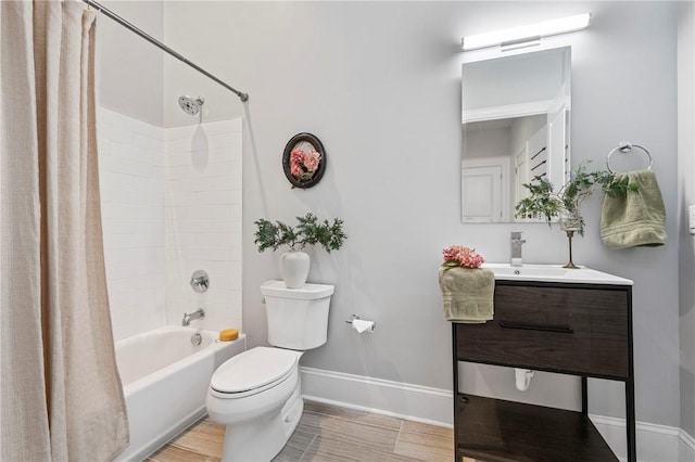 full bathroom with hardwood / wood-style flooring, vanity, toilet, and shower / tub combo