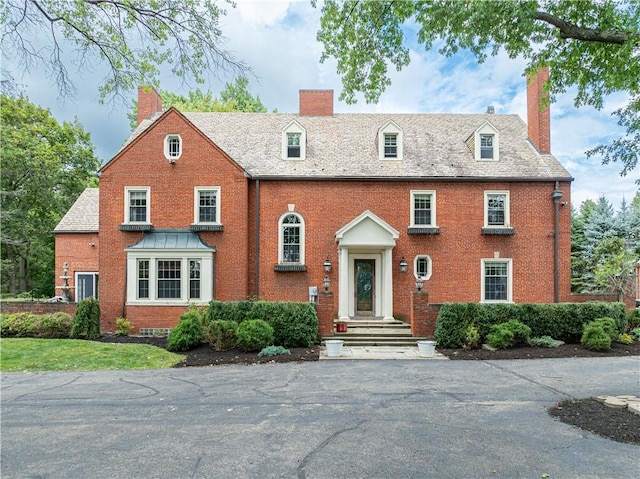 705 E Beau St E, Washington Boro, PA 15301 - view of front facade featuring a chimney and brick siding