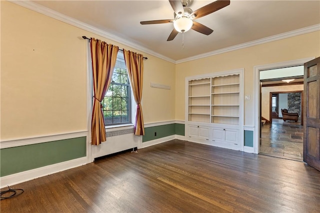 unfurnished room featuring built in shelves, ceiling fan, dark hardwood / wood-style flooring, and ornamental molding