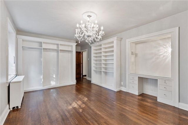 interior space featuring a chandelier and dark hardwood / wood-style flooring