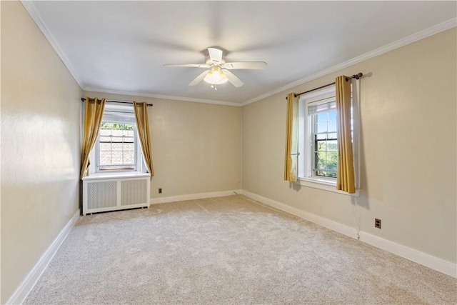 unfurnished room with radiator, ceiling fan, light colored carpet, and ornamental molding