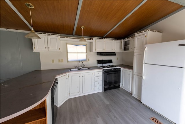 kitchen with white cabinetry, sink, hanging light fixtures, light hardwood / wood-style flooring, and white appliances