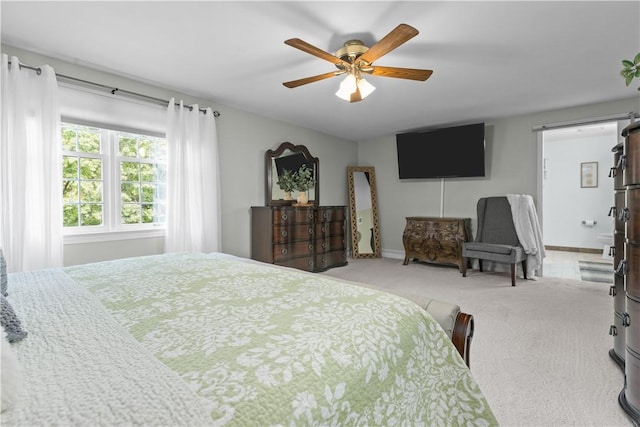 bedroom with light colored carpet and ceiling fan