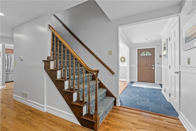 foyer entrance with hardwood / wood-style floors