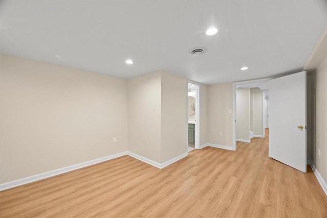 basement with light hardwood / wood-style floors