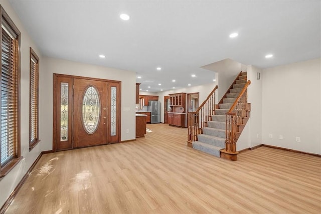 foyer with light hardwood / wood-style floors