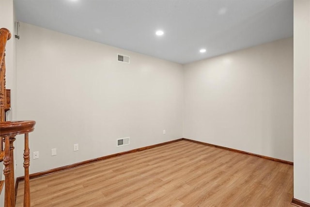 spare room featuring light hardwood / wood-style flooring