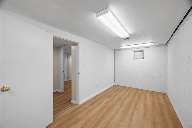 basement featuring light hardwood / wood-style floors