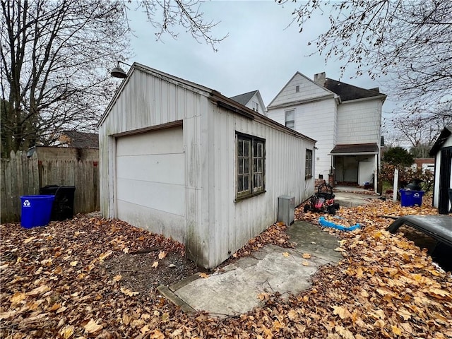 view of side of property featuring an outbuilding and a garage