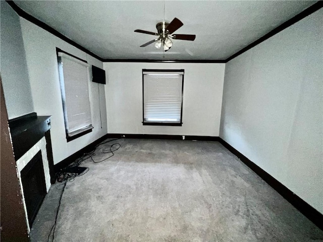 unfurnished room featuring ceiling fan and ornamental molding