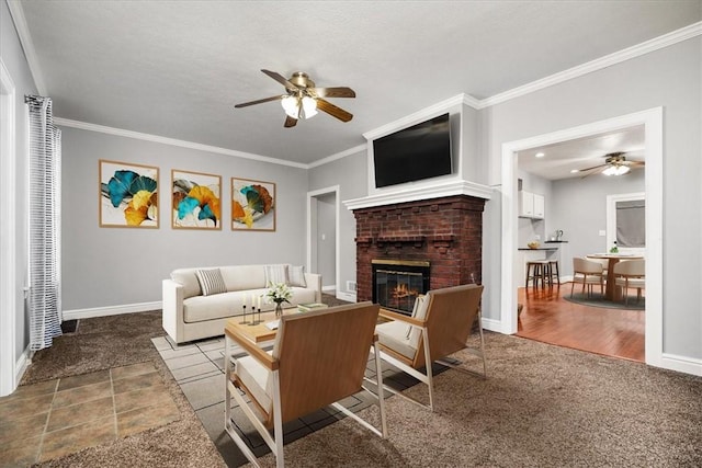 living room with crown molding, ceiling fan, light colored carpet, and a brick fireplace