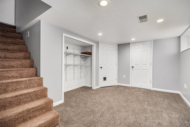 basement with carpet floors