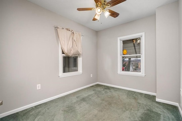 carpeted empty room featuring ceiling fan