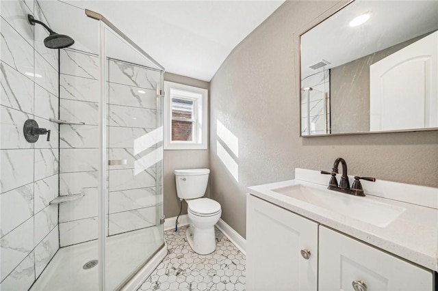 bathroom with tile patterned flooring, vanity, toilet, and a shower with door