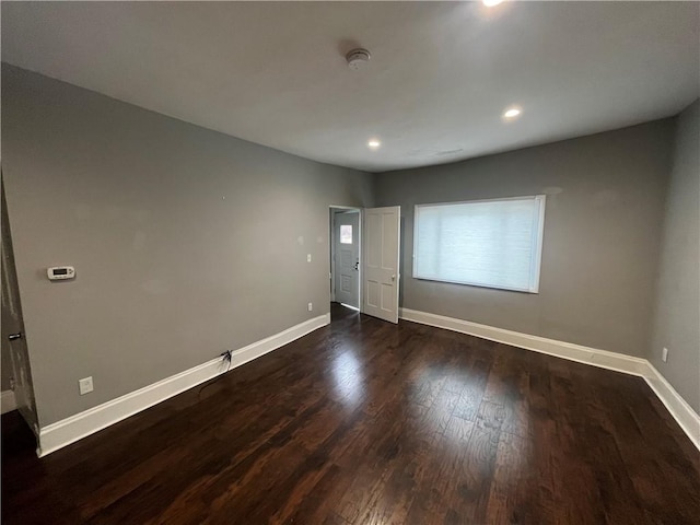 unfurnished bedroom featuring dark hardwood / wood-style floors