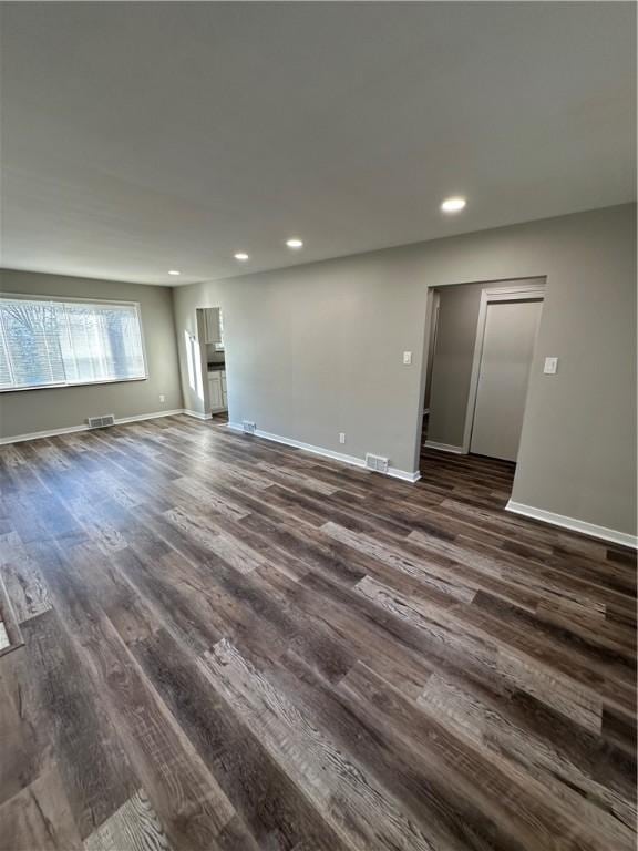 empty room with dark wood-type flooring