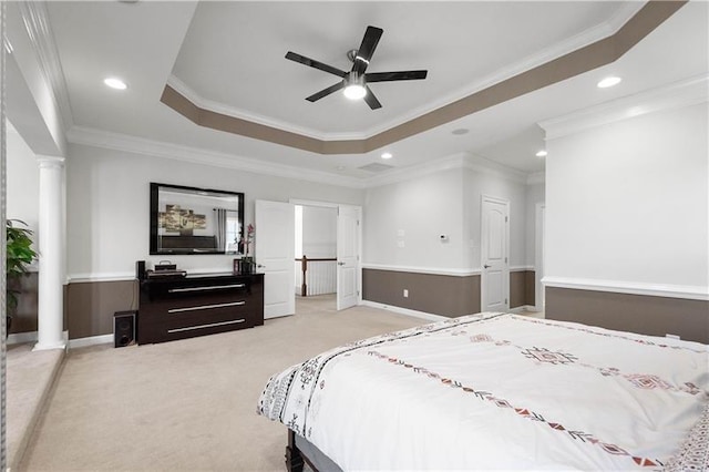 bedroom with ceiling fan, light colored carpet, crown molding, and decorative columns