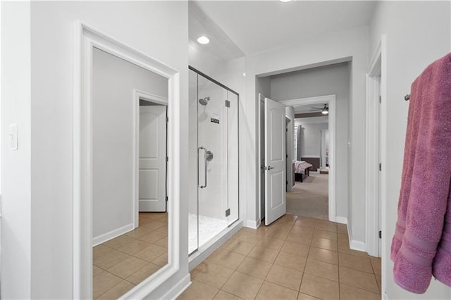 bathroom featuring tile patterned floors, ceiling fan, and walk in shower