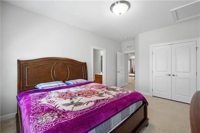 bedroom with light colored carpet and a closet