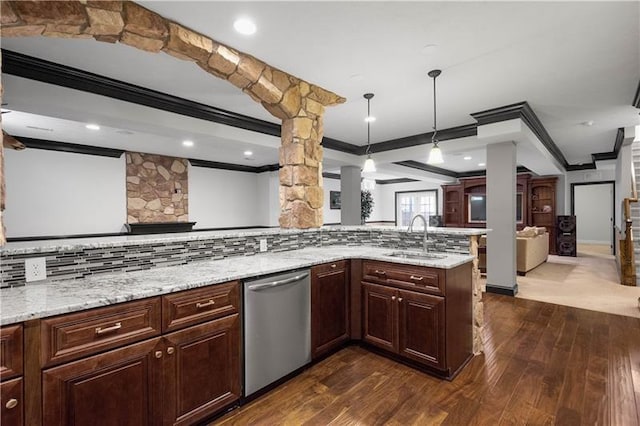 kitchen featuring sink, stainless steel dishwasher, dark hardwood / wood-style floors, kitchen peninsula, and decorative light fixtures