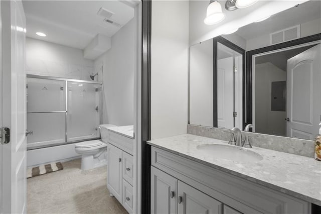 full bathroom with vanity, toilet, and combined bath / shower with glass door