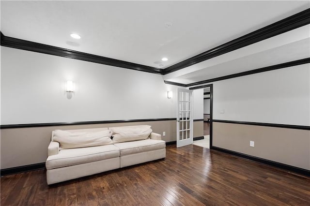 unfurnished living room with dark hardwood / wood-style floors, ornamental molding, and french doors