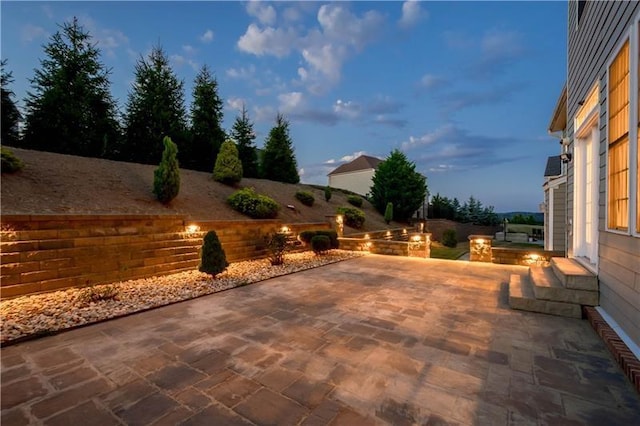 view of patio terrace at dusk