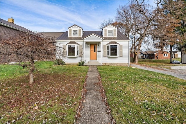 cape cod-style house with a front lawn