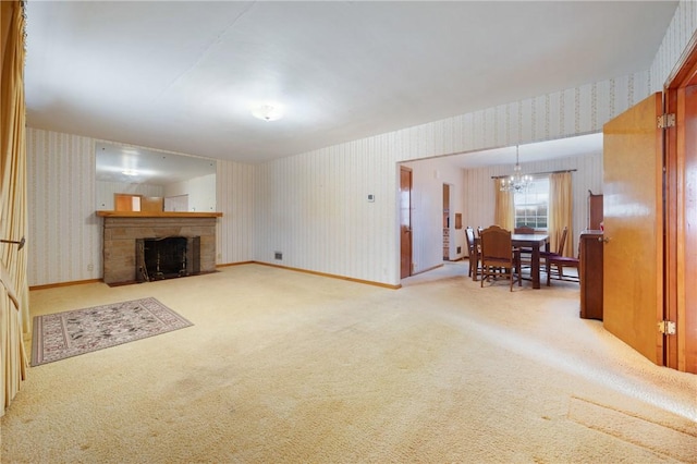 living room with carpet and a chandelier